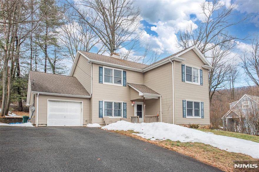 Located in Denville's desirable Beacon Hill neighborhood, just minutes from the Denville NJ Transit train station, vibrant downtown Denville, and major highways, this home offers an exceptional opportunity in one of Morris County's most sought-after communities. Enjoy the charm of this historic neighborhood while being within easy reach of local restaurants, shops, parks, and even nearby farm stores offering fresh eggs and sourdough bread. The home features a flexible layout with generous first floor living space, including a bright living room, dedicated home office, and a kitchen with plenty of room for everyday living and entertaining. Upstairs you'll find four bedrooms and a large Jack-and-Jill style full bathroom, providing comfortable accommodations and great functionality. Additional storage is available with a pull-down attic, while the one-car garage offers extra storage space and includes the laundry area. Recent updates include a newer above-ground oil tank and central air conditioning. The home is connected to public utilities, with natural gas available on the street for future conversion. The previous underground oil tank was professionally removed with permits and soil testing confirmed clean. The second-floor addition was completed in 2004 with proper permits. With its east-facing orientation, prime location, top-rated Denville schools, and strong neighborhood appeal, this property offers a wonderful opportunity to move in and make it your own.