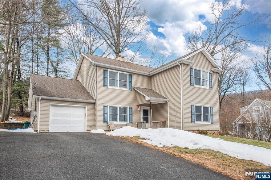 Located in Denville's desirable Beacon Hill neighborhood, just minutes from the Denville NJ Transit train station, vibrant downtown Denville, and major highways, this home offers an exceptional opportunity in one of Morris County's most sought-after communities. Enjoy the charm of this historic neighborhood while being within easy reach of local restaurants, shops, parks, and even nearby farm stores offering fresh eggs and sourdough bread. The home features a flexible layout with generous first floor living space, including a bright living room, dedicated home office, and a kitchen with plenty of room for everyday living and entertaining. Upstairs you'll find four bedrooms and a large Jack-and-Jill style full bathroom, providing comfortable accommodations and great functionality. Additional storage is available with a pull-down attic, while the one-car garage offers extra storage space and includes the laundry area. Recent updates include a newer above-ground oil tank and central air conditioning. The home is connected to public utilities, with natural gas available on the street for future conversion. The previous underground oil tank was professionally removed with permits and soil testing confirmed clean. The second-floor addition was completed in 2004 with proper permits. With its east-facing orientation, prime location, top-rated Denville schools, and strong neighborhood appeal, this property offers a wonderful opportunity to move in and make it your own.