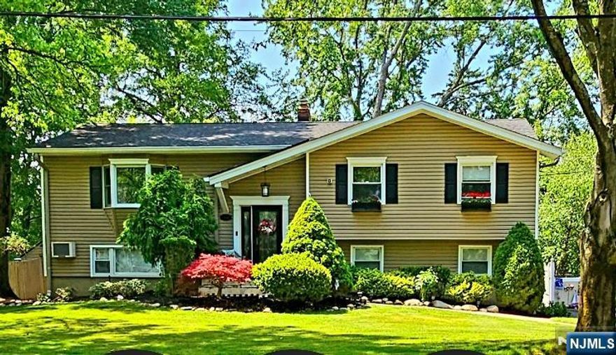 Welcome to an immaculate home in the most sought after West Paramus! Well appointed on park like property for your enjoyment and family gatherings, this Bi-evel features 4 bedrooms two full baths and a powder room. Pride of ownership abounds this much loved home, thoughtfully updated throughout with a stylish kitchen, island and wine cabinet in the heart of the home, generous sized rooms, beautiful hardwood floors, family room, a summer kitchen with Laundry room, three season room, two car garage,central air, alarm, Generac and so much more!