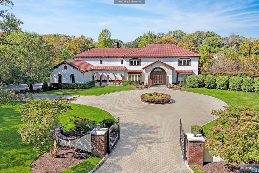 Entertainer's delight with 5BR and 5 1/2baths.Hardwood floors throughout, open concept, numerous outdoor decks, patios, pool, and pond views in a welcoming neighborhood. First flr offers a wonderful flow for indoor & outdoor living, custom mouldings, 5 woodburning FPLs.Marble EF leads to LR & formal DR with access to slate patio and entertaining. LR leads to Library, custom woodwork w/fp. French doors opening to a deck offering privacy and pond views.Recently updated kitchen is the heart of the home with stone fp,stainless steel appliances, kitchen area has an open flow w/ family rm and breakfast rm. Every room is light filled with views of the landscaped back yard, stone patio, gunite pool. First flr also boasts a pdrm,BR,w/fb&laundry. Two staircases lead to the 2nd flr. Primary bedrm w/FB,sitting rm. w/fp, 3 WIC, dressing rm & private balcony.Three additional BRs, each w/full bath and 2nd floor family rm. Lower level is fully finished. Owner has NJ RE license.