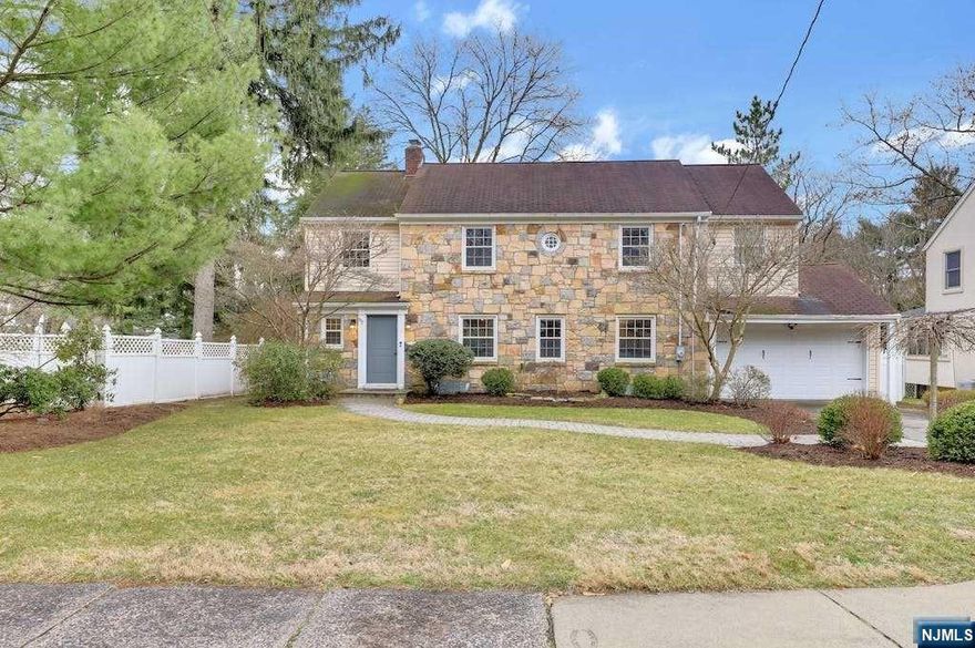 Living is easy in this this charming colonial on the highly desirable East Hill of Demarest. As you walk through this home you will notice that all details have been carefully selected to reflect its timeless style. An entertainer's dream, the expansive living room or dining room with fireplace greets you to the stunning sun-drenched great room. Escape to your fully fenced yard with private stone patio overlooking the park-like property. The first floor is completed with an updated kitchen with high-end appliances, bedroom, private office and powder room. Second level boasts a luxury master suite featuring a renovated bath, 2 spacious bedrooms and modern full bathroom. Finished basement includes a recreation room, laundry room and storage. Welcome home!