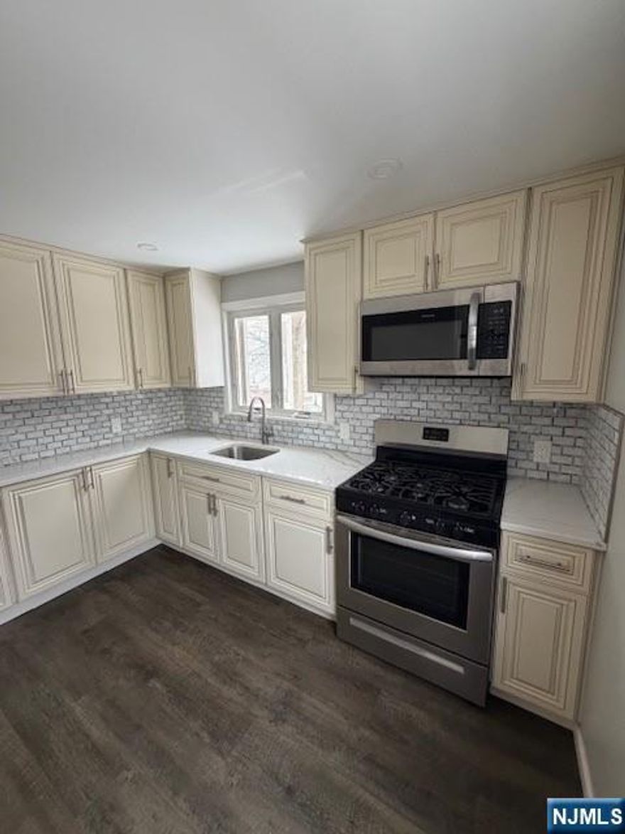 Totally Renovated Bright and sunny Two Bedroom Apartment hardwood floors throughout modern kitchen with marble countertop and stainless steel appliances and Modern Bathroom two good sized bedrooms .living room dining area your own private washer and dryer in the basement. Great location very convenient to shopping .restaurants, schools ,parks and public transportation.