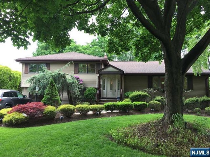 A beautiful spacious house in desirable Glen Rock. This home has it all: from best location near park, NYC transportation, Shopping and school to a large deck with retractable awning overlooking private back yard. The house features modern eat in kitchen with granite countertop and s/s appliances. Dining room, LR Great Room with fireplace and sliding glass doors to the large deck complete the first floor. 2nd level has a master bedroom with half bath, 2 bedrooms and a full bath. Ground level has a den, full bath and laundry room. Basement is finished. Landscaping and lawn maintenance included in the rent.