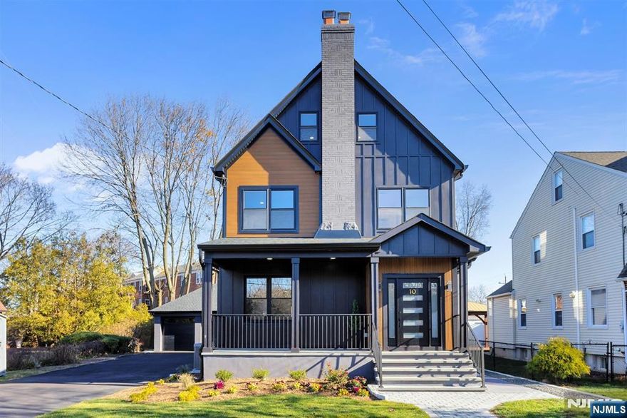 Prepare to be impressed by this beautifully reimagined three-story residence, set on an oversized lot and complemented by a spacious three-car garage with additional parking for up to 8 carsâ€”a rare and exceptional offering. Thoughtfully redesigned from top to bottom, this truly move-in-ready home showcases refined finishes, generous living spaces, and remarkable flexibility for future growth. The main levels feature four well-appointed bedrooms, including two with private en-suite baths, three full baths, two half baths, a gracious living room, an inviting dining room, and a sleek, open-concept modern kitchen. The fully finished basement adds valuable lifestyle space with a laundry room and powder room. On the third floor, discover three versatile bonus rooms, perfect for a home gym, private office, creative studio, or playroomâ€”limitless possibilities tailored to your lifestyle.