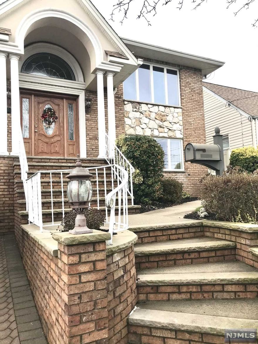 Move in Ready 2 Family All Brick Custom Built Builder's Home in the most desirable section of town which has been updated many times since contruction. Main Flr features 7 rooms including Master Bedroom w Master Bath, 2 Walk in Closets, 2 Add'l Bedrooms, Main Full Bath, Formal Livingroom, Kitchen w Custom Cabinets w Center Island, Granite Countertops, SS Appliances including Wine Refrig, Door to Full Size Trex Deck/Yard, Diningrm, Large Family Rm w Double-Sided Fireplace, Cathedral Ceiling and Skylights. Ground Flr has Summer Kitchen w Door to the Patio/Yard, Livingrm, Bedroom, Full Bath perfect for Extended Family. Rental Unit has New Kitchen w Granite Countertops, SS Appliances inlcuding Dishwasher, Full Bath, 2 Bedrooms, Washer/Dryer in Unit w Private Side Entrance. Vinyl PVC Fenced in Yard, One-Car Attached Garage w remote, Paver Driveway, Sprinkler System, Hardwood Flrs, Central Air, Baseboard Ht, Crown Molding, Recessed Lites, Central Vaccuum, Freshly Painted, New Carpeting