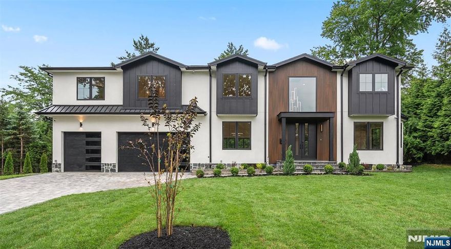 Experience refined living in this new residence, built on an expanded existing foundation on a quiet cul-de-sac in East Hill. With 5 bedrooms and 5.5 baths, this home welcomes you with a grand open kitchen, sun-filled family room, formal dining area, and a flexible living/multi-purpose space, perfect for entertaining or everyday moments. A private guest suite with full bath completes the main floor. Upstairs, the serene primary suite features a private balcony overlooking a lush backyard. A lounge/loft connects three additional en-suite bedrooms, offering comfort and privacy for all. Located in Tenaflyâ€™s prestigious East Hill â€” minutes to shops, schools, parks, and houses of worship. Seller is a licensed real estate agent