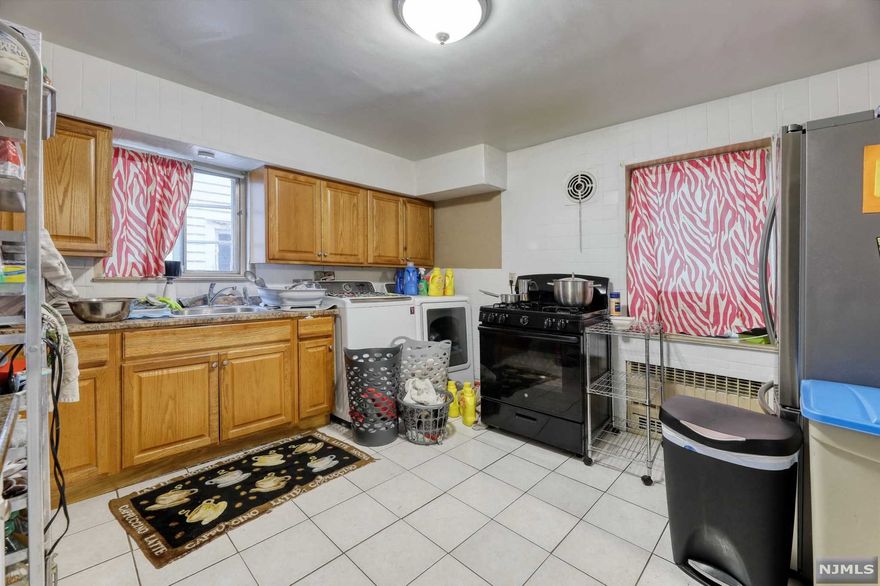 All brick 2 family, each unit has 3 bedrooms, tiled bathrooms, living room, dining room, full kitchen, and a washer dryer hookup in unit. Hardwood floors throughout. Very spacious units, all generously sized rooms with parking for 4+ cars. All new utilities. Semi-finished basement w full bath. Great Location across from beautiful park and playground. All new utilities. Close to public transportation and shopping.