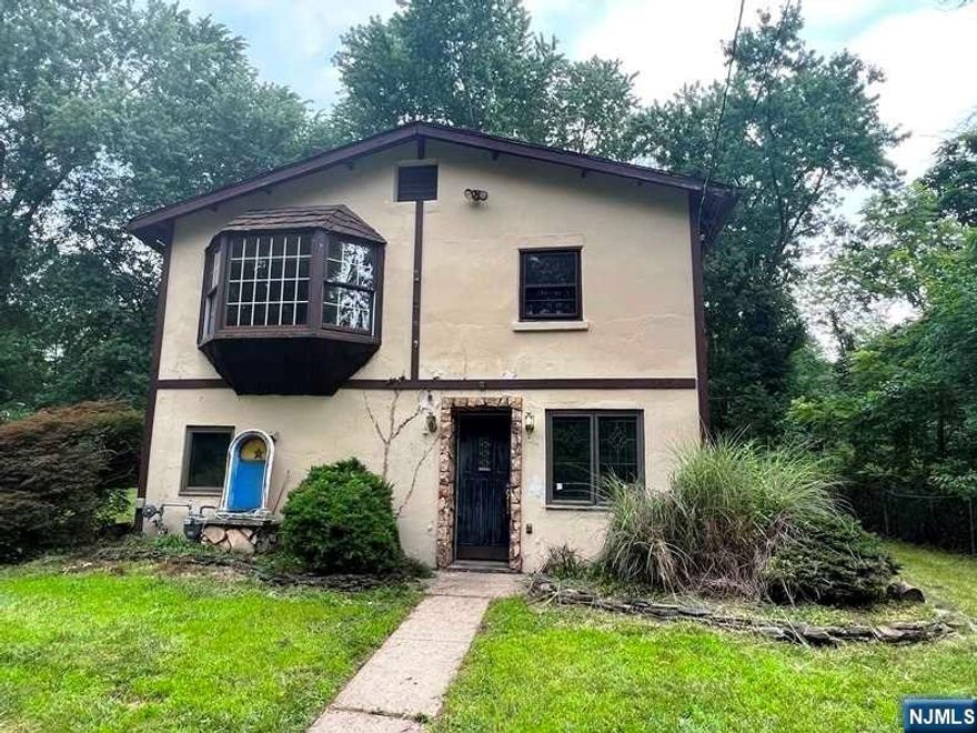 Make your own this two-story charming colonial house in Wayne and take advantage of its great school system. This home features on the 1st Floor, a Large living room, kitchen, and a full bathroom. The 2nd floor has three bedrooms, a small second kitchen, a second living room with a hardwood floor, and a full bathroom. The property has a rear deck and a large backyard. Property located in a flood zone and it is ready for your creativity!