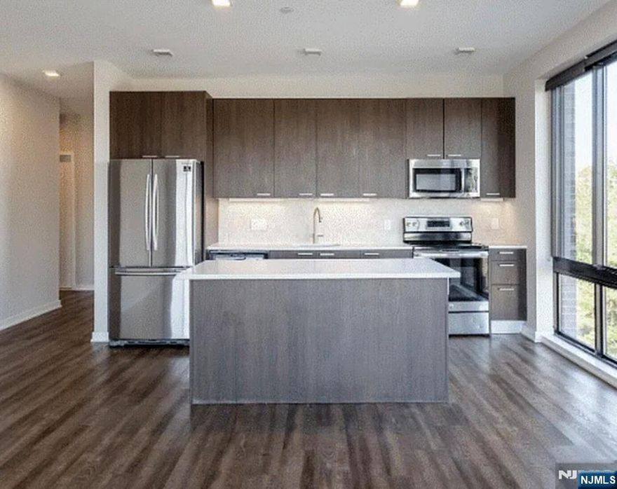 Welcome to The VUE Hackensack located in the heart of Hackensack NJ. This stunning 2 bedroom is perfect for those seeking a comfortable and convenient living space. The Bergen floor plan offers you a luxurious entry foyer to make you feel at home. The amenities at The VUE Hackensack are top-notch with a club room, patio, BBQ area, gym, fire pit, and private garage ceramic tile, an open kitchen-layout that has seating around an island. Be in charge of your own heat and AC systems with the in-unit thermostats. Enjoy the convenience of your in-unit washer and dryer. The VUE Hackensack offers residents the safety of a secured community with 24/7/365 CCTV, controlled FOB access for all entry points, virtual doorman system, and enclosed parking garages. Our management office is on-site to assist you with any requests you have. Our maintenance staff here to assist you with your personalized requests and help create a luxurious experience.