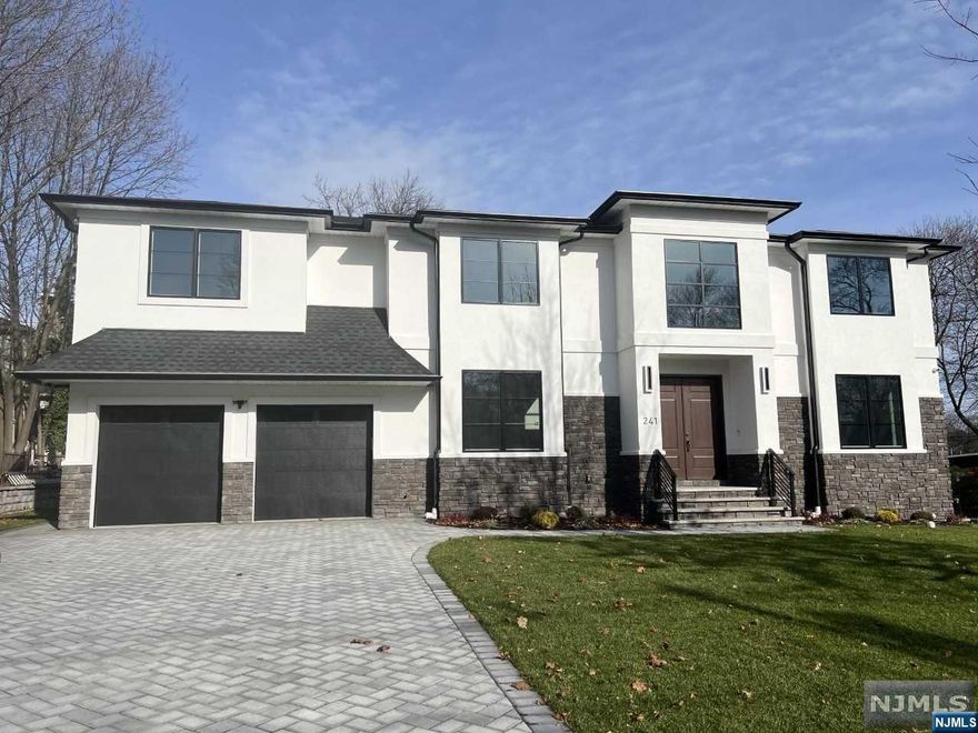 Just Completed, Beautiful Brand New 6 BR, 5.5 Bth Contemporary Colonial with High-end finishes and 6,750 sf of living space. Stone/Stucco Exterior over Hardie Board. 2 Story EF & 10'Ceilings on the 2,450 sf 1st Flr, FLR, FDR, FR w/FPL, LG MEIK & SGD to Rear Patio, BR w/Full Bth, Powder Rm. The 2nd Flr with 2,200 sf has MBR w/LG WIC & MBth, Jr Suite, BR, BR, Jack-Jill Bth, Lndry. All BR's have good size WIC. Full Finished Bsmt with Radiant Heat & 2,100 sf, Home Theater, Gym, Rec Room, Office, BR w/Full Bth & Storage. Polished HW Flrs, Security System with Cameras throughout Interior & Exterior, 5-Zone Heat, Central Vac, Lawn Sprinkler System. Very short walk to Houses of Worship, Bus, Elementary School and Park. Close to County Park, Shopping and easy access to Major Roadways.