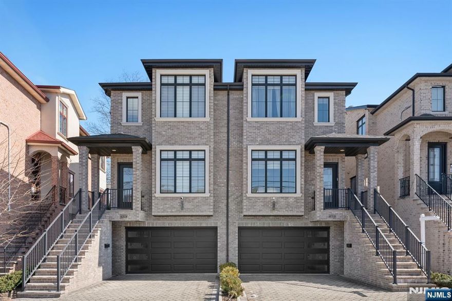 This gorgeous, newly built duplex (2018) offers a spacious and luxurious living experience with three bedrooms and three and a half baths. Boasting the finest finishes, the home is adorned with high-end Porcelanosa tiles and fixtures throughout. Beautiful hardwood floors flow seamlessly through the open-concept living areas. The chef-inspired kitchen features stainless steel appliances, a large center island, and sliding doors that lead to the deck, perfect for entertaining or relaxing outdoors. The inviting living room includes a stunning gas fireplace, adding warmth and ambiance to the space. The primary bedroom is a true retreat, complete with a spa-like primary bath, where every detail, including the tiles and fixtures, is sourced from Porcelanosa. With its exceptional design and attention to detail, it is the perfect blend of modern luxury and comfort just minutes from NYC, public transport, and more.