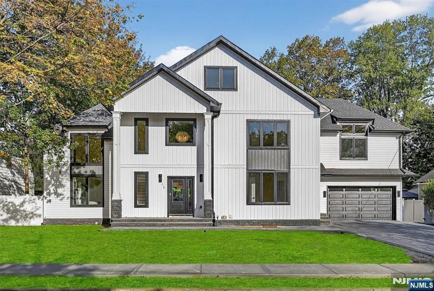 Move right into this newly built, custom-designed home in the heart of Ramsey. Featuring 5 bedrooms and 5.5 baths, this masterpiece is just steps from downtown shops, restaurants, schools, and trains to NYC. The chefâ€™s kitchen showcases Taj Mahal quartz counters, premium appliances, and a spacious island that opens to the great room, perfect for entertaining. Soaring ceilings and hardwood floors set a warm tone throughout. The first floor offers a versatile bedroom with ensuite bath, a large mudroom with garage access, and a stylish powder room. Upstairs, the luxurious primary suite boasts a walk-in closet and spa-like bath. Three additional bedrooms, including one ensuite, plus a laundry and hall bath complete the level. The third floor provides a bonus office or rec room. Moving on the bright lower level has another full bathroom. Outside, enjoy a rare, large flat fenced yard offering exceptional privacy just steps from downtown! WANT MORE INFO? CONTACT LISTING AGENT NICOLE MINETTI @ 201-388-0077/nicole@minettidennisgroup.com