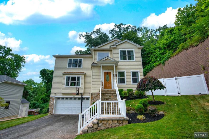 Welcome to Cul-de-sac Living at it's Finest with Low Taxes! Built in 2009 and Perfectly nestled in Lush Greenery! Step through the front door and you're greeted by a Double Story Foyer and Inviting Dining Room. Walk on those Gleaming Hardwood Floors and enter the Spacious Kitchen with Granite Countertops and Stainless Steel Appliances. Sliding Glass Door gives you the perfect access to your Trex Deck for some Great Outdoor Enjoyment! It doesn't stop there, take two steps down to your extended Patio Area for continued entertaining space! Pet-friendly Artificial Turf keeps the yard neat and mud-free and the best part, no lawn mowing or maintenance! Large Living Room with Gas Fireplace and Powder Room complete the first floor. Upstairs boasts a Large Primary Suite with Double Vanity Bathroom and Walk-in Closet! Two Bedrooms and Full Bath complete this level. Completely Move-in Ready Home with Finished Basement and Half Bath, with entrance to Your 2-Car Attached Garage!