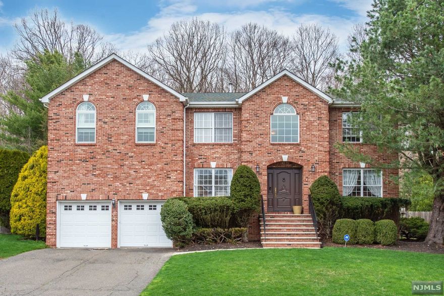 Featured in Volume 13 Issue 4 of New Jersey Home and Design this one of a kind home offers both privacy and luxury in one of Wayne's most sought after communities, Point View Estates. With 4 bedrooms and 3 full baths this home is move-in ready. The master bedroom is spacious and airy with a master bath that is unparalleled in both uniqueness and style. The first floor features a completely renovated eat-in-kitchen features a Miele double oven and Sub-Zero refrigerator/freezer with views overlooking the gorgeous stone patio and gunite pool. This backyard delivers in both seclusion and privacy, providing a true sense of tranquility.