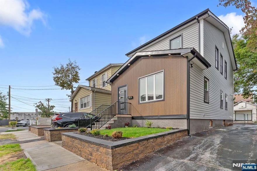 An exceptional property has just hit the market, bringing a new level of style and sophistication. Every detail of this fully remodeled home has been carefully curated to create a one of a kind living experience. This 3 bedroom, 2.1 bath residence features a spacious master suite with a private bath, a finished basement, and parking for 3+ vehicles. Enjoy the comfort of central AC and hot forced air, along with a striking exterior that showcases distinctive facade paneling and a custom, top of the line front door you won't find anywhere else. Inside, the chef's kitchen boasts quartz countertops, elegant cabinetry, and a center island with a built-in microwave. The open living and dining areas provide the perfect setting for entertaining or relaxing. Conveniently located near public transportation, major highways, top schools, and more, this home is truly one of a kind.