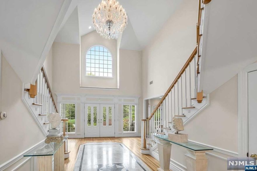 Custom built. Meticulously maintained, professional landscaped with mature trees. Privacy berm, paver patio, babbling brook with bridge, hot tub (2022). Multiple balconies to enjoy the expansive views. Features include gourmet kitchen, custom cabinets and wet bar, two fireplaces (wood and gas burning), study, second study/office/pantry, two laundry rooms, front double staircase, and back stairs with chair lift, whole house water filtration system, reverse osmosis filter. Dramatic second floor landing leads to five of the six bedrooms. The primary bedroom features a gas fpl, skylights, two walk in closets and a spa like bath. The 3-car garage floor was recently finished with a durable epoxy coating and there is a walk-up attic for additional and easy storage. Walk-out finished lower-level w/BR and Bth, huge utility room. FINANCING AVAILABLE TO QUALIFIED BUYER. 30% DOWN. 70% FINANCE INTEREST ONLY 7%, 3 YEARS. Owner has NJ real estate lic.