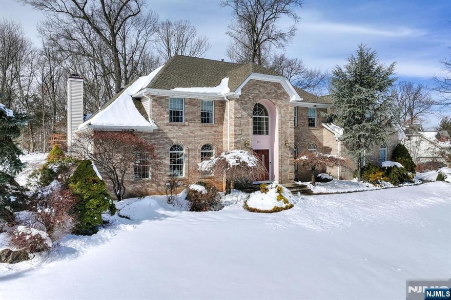 Stately Colonial set on 1.43 acres backing to private wooded surroundings, offering five bedrooms and four and one-half baths in a desirable residential setting. The thoughtfully designed floor plan includes a ground-level in-law suite providing flexible living options, while the primary retreat features a spacious sitting area, full ensuite bath with jetted tub, and generous closet space. A full basement with summer kitchen offers additional recreation or entertaining possibilities. Outdoor living is enhanced by a Trex deck overlooking the expansive property, and a three-car garage provides ample parking and storage. Conveniently located near major highways and mass transit options with access to NYC.