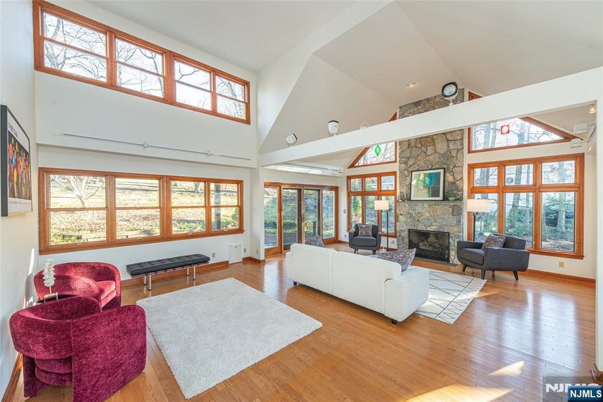 Well maintained, sun-drenched, 4 BR, 2.1 Bath Custom Cape. Over 2,500 Sq. Ft. featuring spectacular 26' great room with gorgeous floor to ceiling stone fireplace, vaulted ceilings, walls of windows and sliders to deck, patio and private .59 acre property. Located in desirable St. Cloud neighborhood with jitney to NYC train at corner and .5 mile to elementary school. Recent updates include new: painted interior, beautifully refinished hardwood floors, 2nd floor carpet and decking. Full finished basement with rec room, workshop, laundry room, 1/2 bath and lots of storage. Central air. Conveniently located near Rt. 280 and GSP, NYC bus and train, Codey Arena, shops, restaurants, S. Mountain Reservation and the Turtle Back Zoo. House is being sold As-Is.