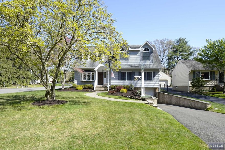 Welcome Home! Stunning Colonial in the Ramapo Mountain Lakes Community of Oakland! Professionally Landscaped and Beautifully Manicured Property. Custom Carpentry throughout the house makes this home a rare find! Entrance Foyer with custom trim and moldings, dining room with custom built-ins, gorgeous custom eat-in kitchen open to the Family Room with 23' Vaulted Ceilings and Gorgeous Wood Burning Stone Fireplace! Hardwood Floors, Full Bath and 3 Bedrooms on First Floor. Large Master Suite with Tray Ceilings, Custom Walk in Closet and Master Bath with Jacuzzi Tub. Large Private Home Office with custom trim work. Partially finished basement with additional Full Bath, Rec Room, Mud Room, Laundry and attached 1 Car Garage. Private and Level Back Yard Oasis. Multi-Level Deck. New 4 Bedroom Septic System installed in 2018! Close to Schools and Transportation. Close to Crystal Lake. Dont miss this opportunity! One of a kind home!