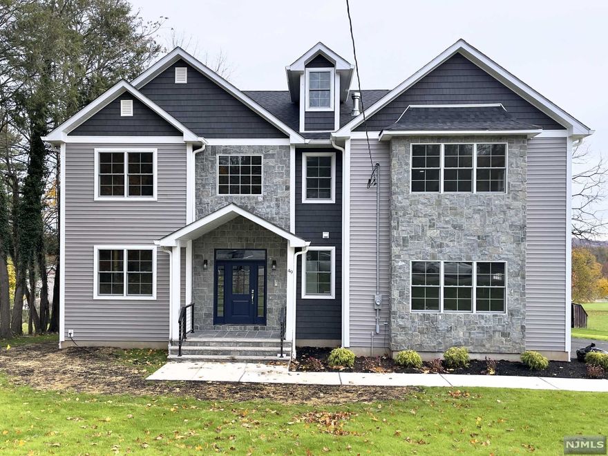 Quality craftsmanship & meticulous attention to detail describes this gorgeous NEW CONSTRUCTION home on a sprawling lot. 10 YEAR BUILDER WARRANTY. This 6BD, 5.5BA w approx. 4,500 sf of finished living space features a dramatic 2 story foyer, formal DR w extensive Millwork & gas FP, gorgeous HW floors which lead to the expansive kitchen & FR w gas FP & sliders to large deck to paver patio below. The kitchen is complete w high-end SS appliances, lg center island, quartz counters, ceiling height cabinetry & large pantry. 1st floor en-suite for guests/office, powder room & mudroom. The 2nd floor is home to 4BDs, 3BAs w MBD w gas FP, walk-in closets & a spa-like bath w a soaking tub, stall shower & 2 vanities & laundry. Full finished walk-out basement w rec room w dry-bar, bedroom/office full bath & 2 car garage