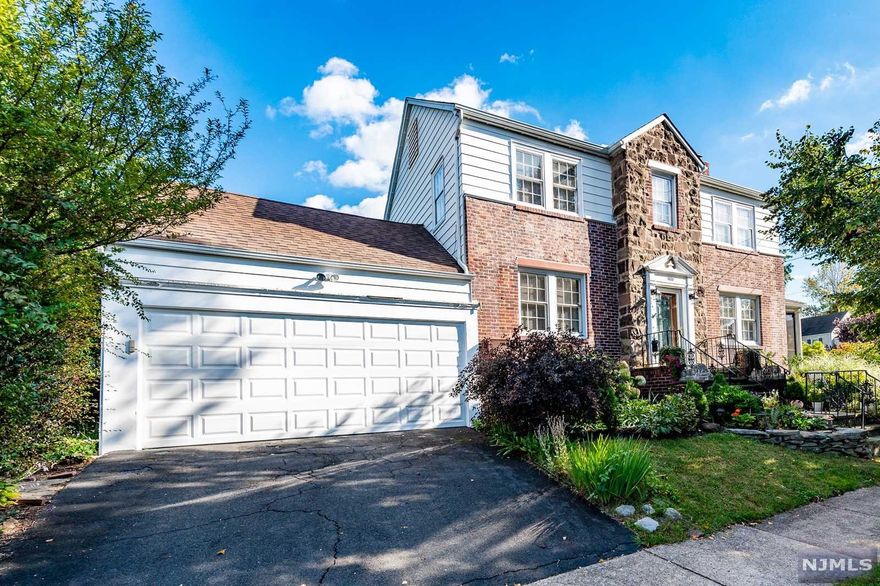 Welcome home to this charming 3 Bedroom / 1.5 Bathroom Center Hall Colonial situated on a corner lot in highly sought after Union Township. Featuring hardwood floors throughout, wood burning fireplace, gorgeous three-season porch, two car garage, and a beautifully landscaped yard. First floor includes entry foyer, living room, formal dining room, eat-in kitchen, powder room, and porch. Travel to the second floor where you'll find three spacious bedrooms, one full bathroom, and access to the attic. Basement level is partially finished and includes a family room, laundry, storage, and utilities. Union Township is conveniently located near public transportation, shopping, restaurants, and parks. Make this your dream home today!