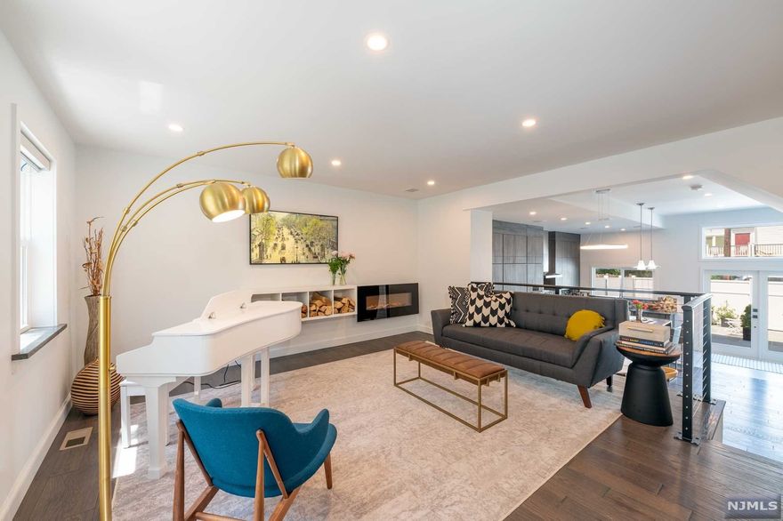 Completely gut-renovated and expanded in 2020, a one of a kind 5 Bed and 5 Bath townhouse sits on a 100ft deep lot with 2 parking spaces. The overhaul included a a third floor and roof deck, all new electric wiring, water pipes, HVAC ducts, Pella windows throughout and prewiring for future smart home customization. The custom kitchen features Bosch appliances, exceptionally crafted cabinetry, a Liebherr 80-bottle wine cooler and Quartz countertops. From the kitchen, the new French doors open out to the private and inviting backyard with sealed bluestone pavers that are also used for the front patio. The second floor boasts a family room with a home-office separated by sliding glass doors, a full bathroom and two bright bedrooms. The new top floor houses a primary bedroom suite with two walk-in closets and an en-suite bathroom, a full bathroom and two connectable bedrooms. The laundry room and a ton of storage are found in the basement. Control4 Smart Home system was installed.