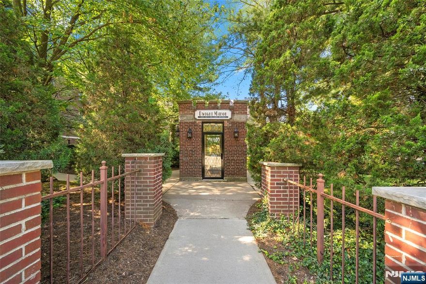 Located in Englewoodâ€™s highly desirable East Hill, this beautifully maintained 2BR/1BA condo at Dwight Manor offers the perfect blend of charm, character, and convenience. This light-filled home features elegant wood-inlay floors, a spacious living room with a cozy wood-burning fireplace, and a functional layout ideal for entertaining. The updated kitchen is equipped with a new refrigerator, new stove, and plenty of cabinetry for ample storage. The oversized primary bedroom offers two closets (including a cedar-lined one) and generous storage throughout. The bathroom is highlighted by classic tilework and a brand-new vanity. Unit B31 enjoys both east and west exposures, filling the space with natural light and offering lovely views of the landscaped grounds. One assigned outdoor parking space is included, along with heat, hot water, common area maintenance, and access to a small on-site gym â€” all covered in the HOA fee. Dwight Manor is a charming elevator building with well-maintained common areas and a convenient card-operated laundry room. Just minutes from downtown shops, restaurants, parks, and NYC transportation â€” and only 7 minutes to the GWB â€” this location is ideal for commuters and anyone seeking the best of Englewood living. Donâ€™t miss your chance to own in one of Englewoodâ€™s most sought-after neighborhoods!