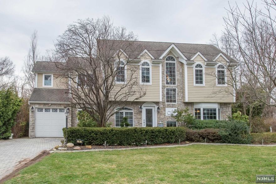 YOUR SEARCH ENDS HERE!! Welcome Home! Every inch of this custom-built colonial has been meticulously planned and spared no expense. Three bedrooms, three full baths tastefully maintained very spacious rooms throughout, and situated on over .34 acres on the sought-after Paramus. The first level boasts an oversized formal living and dining room, a large kitchen with a center island, and stainless steel appliances. Make your way upstairs to the spacious master bedroom suite featuring walk-in closets, luxurious master bath, soaking tub, double sink vanity, and stall shower. two additional bedrooms, a full bath, and a laundry room complete this level. Make your way downstairs to the finished basement where you will find a large recreation room and storage. Enter the backyard and entertain in style. The backyard is perfect for relaxing and entertaining with an in-ground swimming pool and paver patio. Close to houses of worship, shopping, restaurants. THIS IS A MUST SEE!