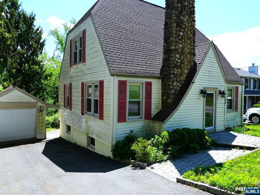 Enjoy classic charm and modern living in this 3-bedroom, 2-bathroom single-family home with beautiful wood trim and a cozy wood-burning fireplace. The updated kitchen features granite countertops and stainless steel appliances, with an adjacent eat-in area. There are two updated bathrooms, including a master bath on the second floor. You'll appreciate the one-car garage, parking for 4+ additional cars, a private sauna room, hardwood floors throughout, a bright walkout basement to a private terraced backyard with a large patio, and the convenience of nearby public transportation.