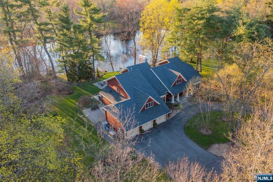 SERENE & PRIVATE 2.33 ACRE ESTATE IS THE SETTING FOR THIS 2017 FULLY RENOVATED 5560 SQFT CUSTOM COLONIAL.TRANQUIL 200 FT WATERFRONT VIEWS OF THE PRIVATE POND AND GORGEOUS RAMAPO MOUNTAIN SUNSETS ARE THE BACKDROP FOR THIS BETTER THAN NEW 4 BR 3.5 BTH HOME. NO EXPENSE SPARED WITH METICULOUS ATTENTION TO QUALITY & DETAIL INCLUDING NEW ROOF, HARDIPLANK SIDING, WINDOWS, HW FLOORS, MODERN GOURMET CHEF'S KITCHEN W/48" WOLF STOVE & 48" SUBZERO REFRIG, BATHS, MECHANICALS, DRIVEWAY, BLUESTONE PATIOS, NAT GAS GENERATOR AND MORE! THE LAYOUT WAS REIMAGINED WITH TODAY'S MODERN LUXURY LIVING IN MIND.THE HOME OFFERS FLEXIBLE FL PLAN AS WELL AS EXPANSIVE PRIMARY SUITE W/FPLC, LUX BTH, SAUNA, HUGE CLOSET AND BALCONY. BUYERS WILL LOVE THE PERFECT BLEND OF STYLE, LUXURY & COMFORT.SECURITY SYSTEM, SMART LOCKS, NEST THERMOSTATS, MUNICIPAL WATER & SEWER W/WELL FOR LANDSCAPING. 220V GAR OUTLET EV CHARGER, .6 MILES TO RAMAPO RESERVATION,3 MILES TO CAMPGAW SKI AREA, 2.4 MILES TO DARLINGTON GOLF COURSE.