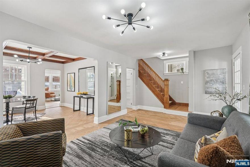 Introducing this beautifully restored single-family residence in the desirable, quiet section of Ridgefield Park. A charming enclosed front porch welcomes you â€” perfect for relaxing mornings or evening unwinding. Step inside to a formal living room where gleaming original parquet floors flow seamlessly into the elegant dining area, highlighted by restored coffered ceilings. The fully equipped kitchen features stainless steel appliances, shaker cabinetry, and quartz countertops. An inviting archway opens to a sun-filled family room, completing the main living level. Upstairs offers three comfortable bedrooms and a stylish full bathroom. A versatile attic provides excellent bonus space for storage or future possibilities. The lower level includes a spacious family/recreation room, washer/dryer hookups, utilities area, and potential for a second bath. Additional highlights include a detached garage, private driveway, and backyard. Ideally located near downtown Ridgefield Parkâ€™s Main Street, featuring local dining, boutiques, and restaurants. Enjoy the scenic beauty of Overpeck County Park and nearby recreational fields. Just approximately 6 miles to New York City with easy access to all major highways â€” just unpack and enjoy.