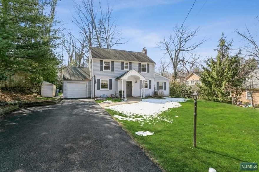 Found on Tenafly's most desired East Hill, this totally renovated 4 bedroom Center Hall Colonial is move-in ready and will not last long in today's market! Entry foyer and gleaming hardwood floors welcome you to formal dining room and bright formal living room with wood burning, perfect for entertaining. Modern kitchen with access to backyard and stainless appliances, powder room, new addition large first floor bedroom and full bath complete the first floor. Second floor boasts new primary suite, 2 additional bedrooms and new full bath. Newly renovated full finished basement, 2015 hot water heater, 2014 central air conditioner, new garage door and so much more. Do not miss this opportunity to live in an excellent location, close to town, houses or worship and premier school district!!