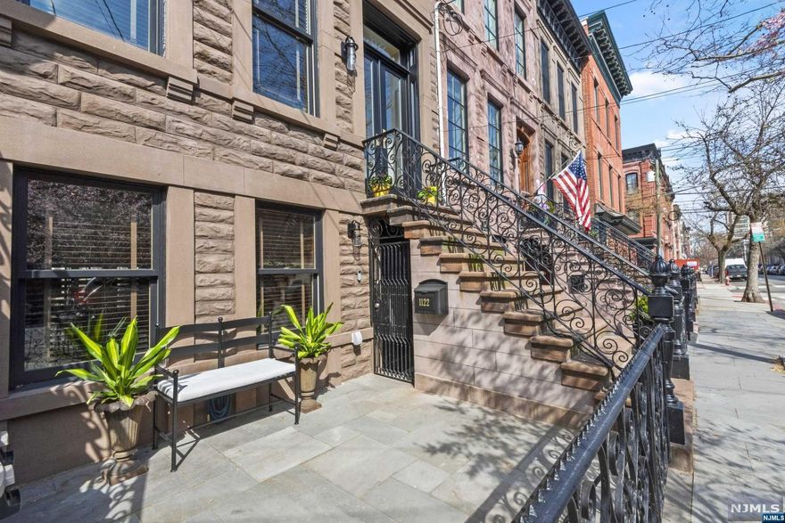 Perfection on Park. This exquisitely renovated four-level townhome is a stunning combination of old world magnificence and contemporary living. Impressive wide, true brownstone home with high ceilings and beautiful natural light throughout. 5BR 2.5BA Four levels of gorgeous living, with wrought iron terraces off the top two floors and bluestone garden in back with built in gas for grilling and firepit. Finished basement, open concept kitchen dining, LR and bonus Elevator Shaft. Gas Fireplaces, 2 zone AC, pocket doors, great uptown Hoboken Location! Have it all.