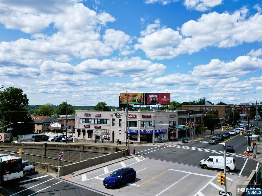 This is a highly visible 6 UNIT (3 retails & 3 residentials) building in a TRIPLE A+ location on the BUSIEST corner of Broad Avenue and Route 46 ramp (Columbia Ave). Very well maintained and great condition building with an attached parking lot with 12 parking spaces. Gas meters and electric meters are all separate and updated. NYC bus stop is right outside. Yearly NET income is already great (net income is over $180,000/year) with current super modest rent rates, BUT potential for MUCH more with current market rent rates. This building is priced extremely well. THANK YOU!!!