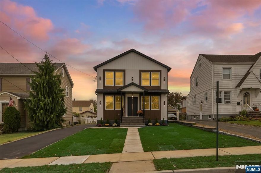 Custom designed and tailored modern luxury masterpiece offering uncompromising quality and functionality throughout. This magnificent colonial style home offers an open floor concept while nestled on a quiet residential street close to NYC public transportation. As you walk in, you will be greeted by the sun-filled living room, dining room and eat-in kitchen. Inviting chef's kitchen, butler's pantry, breakfast counter with seating. Bedroom/office, full bathroom completes the first level. Primary suite w/walk-in closet and en-suite bathroom; two add'l bedrooms, one with a magnificent New York City skyline view, full main bathroom and laundry room completes the upper level. Full size attic w/pull down stairs for storage. Spacious and finished lower level with family room, powder room, utility room and storage room. Large level yard great for entertaining. Detached garage. Close to NYC transportation (train and bus), Restaurants/Shopping! Exquisite living experience! Welcome home...