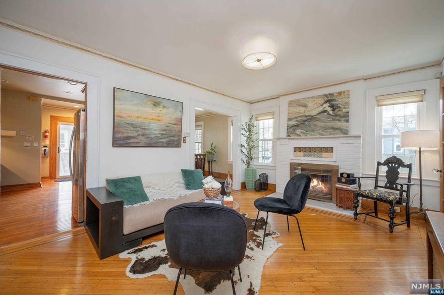 This holiday season, a delightful gift awaits you in sought-after Montclair NJ. Unwrap it and you will discover a 3-bed/2-bath colonial charmer! Step into the foyer where natural light bathes hardwood floors. The living room beckons you to unwind by the fireplace, creating a cozy retreat during chilly evenings. The kitchen which opens to the dining rm boasts sleek countertops, modern appliances- a perfect space for hosting intimate gatherings. With a seamless indoor/outdoor flow, the backyard oasis provides a private sanctuary. Whether you're entertaining guests or enjoying a quiet morning coffee, the outdoor area offers versatility and tranquility. Escape to the private office surrounded by windows to finish business for the day. The upstairs offers 3 bedrooms and a full bath. A finished basement offers a family room, full-bath, laundry room and plenty of storage. Just minutes 2 parks, town pool, downtown attractions and bus to NYC. Come enjoy all Montclair has to offer!