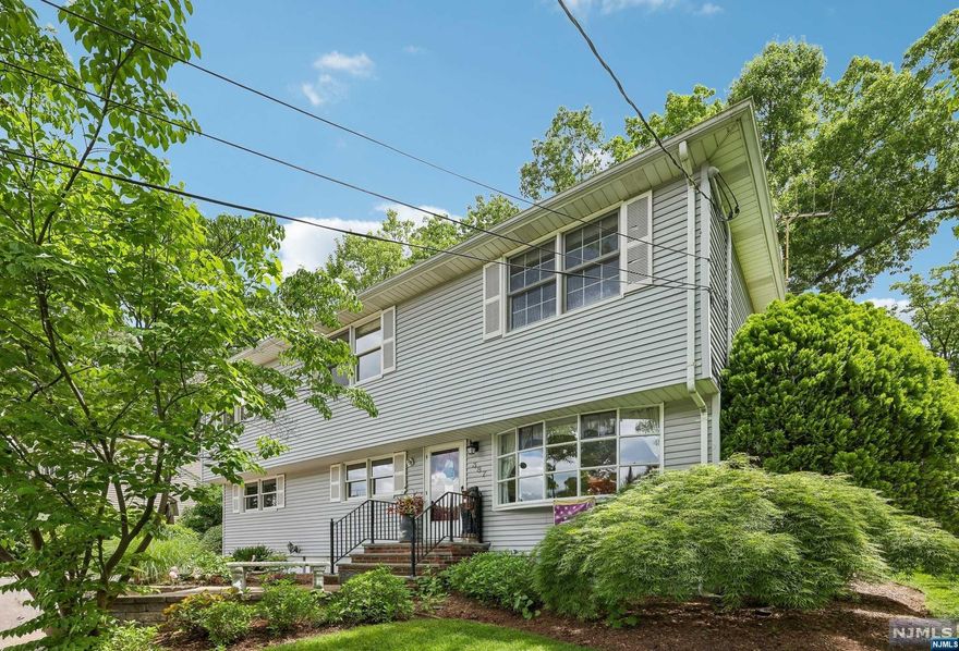 ABSOLUTELY TURN-KEY. THIS 5/6 BEDROOM COLONIAL PERCHED UPON A WELL MANICURED & PROFESSIONALLY LANDSCAPED PROPERTY ON A QUIET RESIDENTIAL BLOCK IS PERFECTLY LOCATED WITHIN CLOSE PROXIMITY TO THE ELEMENTARY SCHOOL. MAIN FLOOR OFFERS OPEN CONCEPT, SUNDRENCHED ROOMS: FORMAL LIVING ROOM, DINING AREA, UPDATED KITCHEN WITH GRANITE COUNTERS & STAINLESS APPLIANCES, FAMILY ROOM W/ ACCESS TO DECK/PATIO & WOOD BURNING STOVE, MAIN FL BEDROOM, FULLBATH, PRIVATE OFFICE(ADDITIONAL BEDROOM), & READING ROOM. THE SECOND LEVEL OFFERS 3 WELL SIZED BEDROOMS - ONE OF WHICH HAS A SMALL BALCONY/STAIRS TO ACCESS BACKYARD, MASTER BEDROOM W/ SITTING AREA (WASHER/DRYER HOOKUP), & FULL BATH. FINISHED LOWER LEVEL IS IDEAL FOR EXTENDED FAMILY - OFFERING REC ROOM, FBA, LAUNDRY, STORAGE, ACCESS TO 1 CAR GARAGE, & OUTDOOR ACCESS. FULLY FENCED YARD. KOI POND/WATER FEATURE. TREMENDOUS LIVING SPACE & SLEEPING QUARTERS. PAVER DRIVEWAY & PATIO. THE PERFECT HOME.