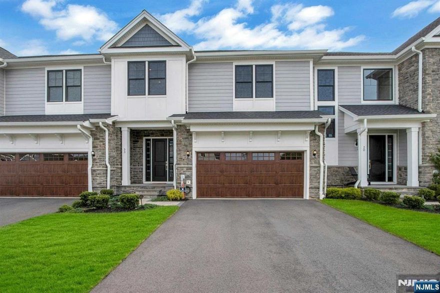 Luxurious Townhome in Sought After The Fairways at Edgewood! Breathtaking community on picturesque property! This home offers high ceilings, gleaming hardwood floors and a modern open floor plan. The welcoming foyer leads you into the expansive living room and open modern kitchen including a large center island, Quartz countertops, custom white cabinets and high-end stainless steel appliances. The spacious dining room features sliding doors to a private paver patio with a built in grill. A half bath, large pantry and storage closet completes the first level. 2ND level offers a beautiful primary site including two custom closets and a luxurious full bath with a soaking tub, separate shower and double vanity.Two additional bedrooms, one with private access to the guest full bath. A spacious laundry room completes the second level. A fully finished lower level includes an expansive recreation room, storage and modern full bath. 2-car garage! Club membership available.