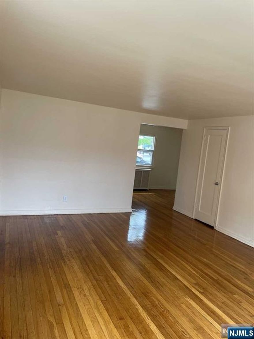 Large, bright, and spacious apartment offering over 800 sq ft of living space, with hardwood flooring throughout. The unit includes kitchen appliances, heat, water, and building maintenance. Prime location â€” NYC transit is right in front of the building, and the apartment is close to shopping and major highways for an easy commute.