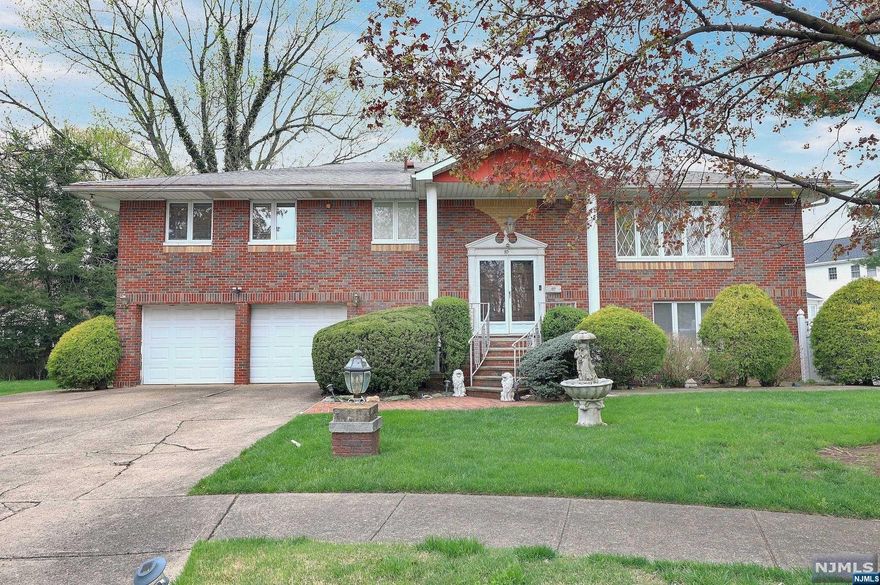 WOW! Unlike any you seen! MUST SEE INSIDE! NOT your average bi-level! This 3850+ SF home was custom-built as the builder's personal home & is SO large & SPACIOUS, sets on a private the cul-de-sac. The home also has a gorgeous in-ground pool & large backyard! Main Level has HUGE Living Room & open Dining Rm. Elegant Marble floors, Eat-in Kitchen is separated by pocket doors. 4 Bedrooms on main level including large Primary Suite W/ en-suite Bath. Wood floors throughout except back bedroom (wood under carpet). Lower Level is designed for extended family with separate access from side of house. Giant open-concept full Kitchen W/ bar area & beautiful Family Room W/wood-burning FPL & glass doors to backyard/ pool. 5th BR on this level, along with full bath & large Laundry/Mudroom with backyard access. HEATED liner pool is ideal for entertaining in fully-fenced backyard with privacy trees along the back. Huge side yard gives privacy and space from neighbors. MUST SEE IN PERSON!