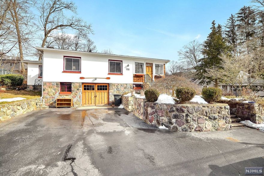 Location! Location! Location! This home sits directly across from beautiful Cupsaw Lake. Upon entering the home you will notice a beautiful entry foyer that can also be used as another sitting area. You will be able to sit back and relax in front of your wood burning fireplace in your sizable living and dining room combo. The kitchen has plenty of storage and gives you great views of the lake. You also have 3 bedrooms along with 2 full bathroom and an unfinished basement that is perfect for storage.