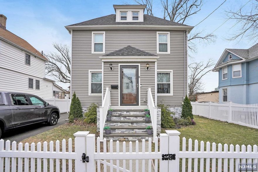 Great opportunity to own a lovely home within walking distance to shopping, restaurants, gyms, library, schools and so much more! 3 bed/2 bath center hall colonial with a renovated kitchen you'll never want to leave. Beautiful counters, new cabinets, stainless steel appliances, built-in wine rack. First floor has living room, dining room and renovated full bath plus large, renovated kitchen. Second floor has 3 beds and renovated full bath. Mud room. Attic is access through the master bedroom and offers a large storage space or play room/office. Full, finished basement. Lovely yard. Improvements in the past two years: gutter guards, stone stairs, stone accents in front of the house, new fence, water softener.