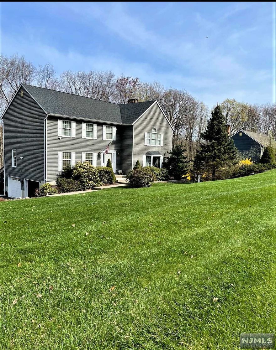 CHARMING COLONIAL SITUATED ON 1.46 ACRES OF MANICURED PROPERTY. STEP INSIDE TO THE DRAMATIC TWO STORY FOYER & SOARING STAIRCASE. THIS HOME FEATURES HARDWOOD FLOOR ON BOTH LEVELS. THE EAT IN KITCHEN & FAMILY ROOM ARE OPEN CONCEPT WITH AMAZING MOUNTAIN VIEWS. THE SECOND FLOOR HAS 4 LARGE BEDROOMS WITH DOUBLE CLOSETS. MASTER BEDROOM RETREAT FEATURES, DRESSING ROOM, WALK IN CLOSET AND GORGOUSE MASTER BATH WITH SOAKING TUB, DUAL SINKS, AND LARGE WALK IN SHOWER . THE FINISHED WALK OUT BASEMENTS HAS BEAUTIFUL CUSTOM BUILT-INS, A BAR, HALF BATH AND GORGOUS LAMINATE FLOORING. THIS BEAUTIFUL HOME IS CLOSE TO SHOPPING, LAKES, PARKS, SKIING, FISHING, HUNTING, HIKING, HIGHWAYS, PUBLIC TRANSPORTATION, 1 HOUR TO NYC & PA. THIS ONE IS CALLING YOU HOME!