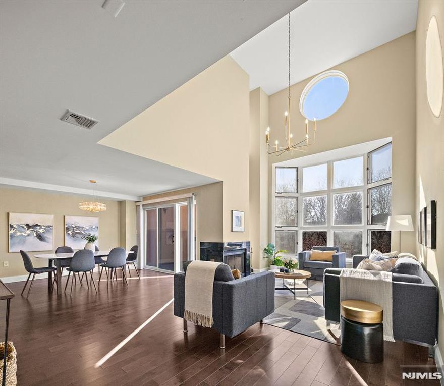 (Contact NELSON CHEN at 2 0 1 - 8 8 6 - 8 0 0 0) - Welcome to 307 Chase Court at INDEPENDENCE HARBOR. This compelling duplex home spans 1769-SF with two bedroom suites plus a full-size bonus room that makes a perfect home office. Located in a prime southern location that provides glorious sunlight, this home has its own private courtyard entry, a private terrace, soaring ceiling heights and a dramatic oversized bay window. Comprehensive renovations to the kitchen and all three bathrooms are accompanied by beautiful wood flooring, premium appliances and a brand new heating & cooling system. Come experience waterfront living with a 24-hour attended gatehouse, outdoor pool, tennis courts, gym, clubhouse and the Hudson Riverfront Walkway that connects to Edgewater Commons and City Place. Two convenient deeded parking spaces add the final touch to this wonderful offering -(Presented by THE CHEN AGENCY, 2 0 1 - 3 4 6 - 8 8 8 8, N e l s o n @ C h e n A g e n c y . c o m)