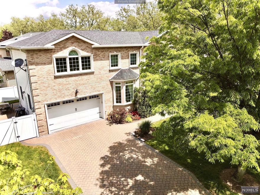 2017 construction with new foundation! Majestic center hall colonial with two-car garage located in a desirable section of Paramus. Step through the exquisite entry of this 6Bed Room, 5Full Bathroom home into a soaring 2 story Marble foyer leading to the bright and airy open floor plan. Modern gourmet kitchen with granite countertop, white cabinets, center island & luxury brand stain less steel appliances. Great room with coffered ceiling, gas fireplace & access to large patio. Stunning hardwood floor throughout first & second floor. Tucked neatly behind the kitchen is a bedroom with full bath. The 2nd floor boasts a Large Master Bedroom suite with full bathroom & walk in closets. Additional Junior suite with its own full bath, & two additional bedrooms with full bath. The large finished basement is perfect for use as a rec room or home theater & includes a bonus bedroom with full bath. Custom Woodwork. Paver driveway, close drive to major highways, parks, dining & shopping.