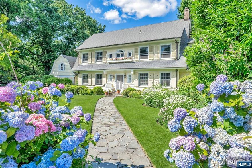 You'll be enchanted by this Nantucket-like retreat in Montclairâ€™s most sought-after neighborhood: Erwin Park. A delightful blend of original charm and open spaces, this home exudes relaxed elegance. Ideally located just 3 blocks from the NYC Midtown Direct train, Watchung Plaza shops, and schools. The white picket fence and garden gate lead to a grand floating staircase, opening to light-filled living and dining rooms, perfect for entertaining. The oak-paneled family room is cozy, while the glamorous sunroom offers a front-row view of the backyard. The updated chef's kitchen with a center island, breakfast room, and pantry is spacious and cheery. A new custom laundry/mudroom adds convenience. The high-ceilinged rec room is perfect for play, WFH, or exercise. The serene primary suite has a renovated bath and spacious dressing room. The fenced backyard features a heated saltwater pool, sprawling lawn, stunning landscaping, vegetable beds, and a charming treehouse! Welcome home!