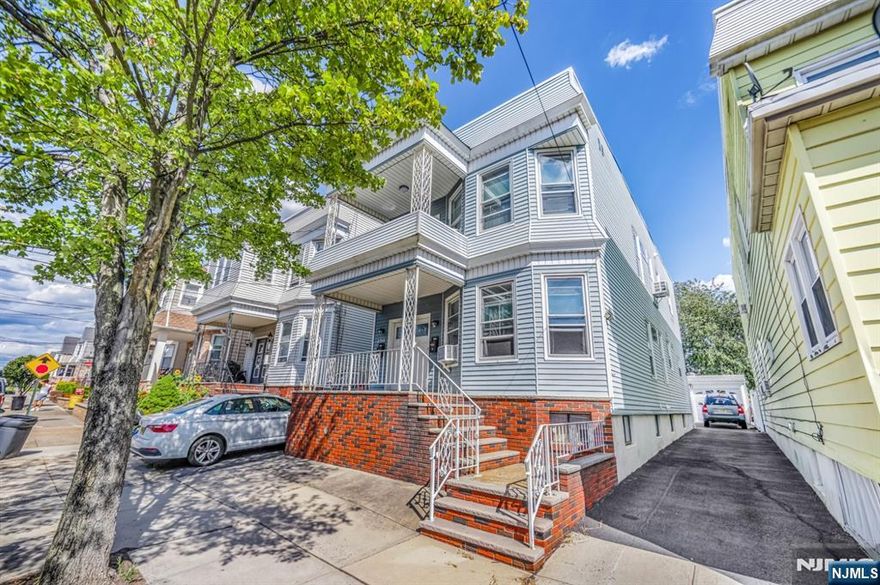 Well-maintained two-family home featuring a newer flat roof, updated windows, and a driveway. The first floor includes two bedrooms, a living room, a dining room, an eat-in kitchen, and a full bathroom. The second floor offers an additional two bedrooms, a living room, a dining room, an eat-in kitchen, a full bathroom, a nook, and a walk-out balcony. The property features updated windows, and it has separate steam/gas heating for each unit. The property also features a semi-finished basement with a full bathroom, recreation rooms, a laundry room, and a storage/utility room, as well as a detached, large car garage.