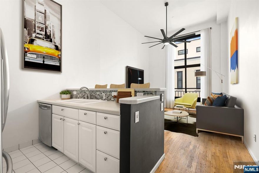 Step into Modern Style in this Fabulous 1 Bedroom Loft +Den Convertible 2 Bed 1 Bath Condo, with an attractive industrial flair vibe. Surrounded by Urban Convenience in thriving Weehawken. This Modern loft style condo offers a tranquil oasis, on the top floor of the building. You will be amazed by a host of distinctive Loft features from soaring 15 ft+- ceilings to tremendous wall sized Windows that fill the Loft with sunshine & light. The open kitchen is ideal to cook in, dine in with newer SS appliances, cabinetry & ready for entertaining with an island/dining bar for gatherings. Travel upstairs to the Loft style den w/ dedicated sleeping space, home office/den. Embrace the flexibility of the Loft duplex, where you have the option to create a 2nd bedroom depending on your lifestyle. The Spacious & Serene Bedroom can accommodate a King sized bed, en suite walls of closets+dressing area w/ vanity & ensuite Modern full bath. An attractive industrial flair dangling light fixture is at the entrance foyer, a newer W/D, complete the floor-plan. Notable newer HVAC, Newer energy efficient thermal Windows, 1 car Garage Pking, Pet friendly. Discover Gregory Commons gated luxury condo complex. Amenities: 24hr concierge, Fitness ctr., Indoor Pool; Sauna; Lounge; courtyard. A Commuter Paradise-only 2-Miles to NYC PA via NJ transit Bus, NY Waterway or Car. Hassle free commuter options are just 2 blocks away. Contact Angela Cuciniello for Details Direct 201.657-6084. Don't Miss out!