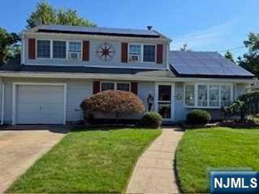 This well maintain home features first floor 2 bedrooms, updated bath, living room w/cozy fireplace, dining room/den w/ skylight, and updated kitchen. The 2nd floor has a separate entrance featuring 1 bedroom, updated bath, living room and eat in kitchen. The well maintained and beautifully manicures yard has a deck with retractable awning ,gazebo, storage shed, dog run a great yard for entertaining. Home is not in flood zone. Shows pride of ownership, don't miss this special opportunity. Multi-generational home.