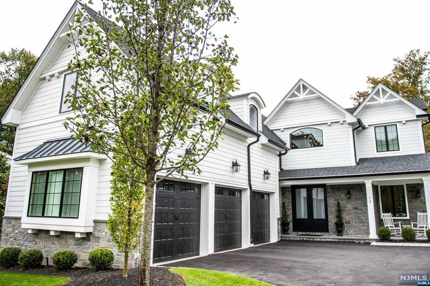 Experience luxury living in this exquisite home, nestled on one of the Tenafly's most beautiful streets. This stunning new construction features a double entry foyer leading into spacious interiors w/high ceilings throughout. Gourmet kitchen is a chef's dream, boasting double islands, a pantry closet, and a butler's pantry. Bedroom on the main floor includes full bath currently used as a cabana room, complete with a fireplace. Enclosed patio with another fireplace and an outdoor kitchen, perfect for entertaining. Relax in the separate Jacuzzi area. 2nd floor is home to a primary suite w/a sophisticated bathroom and expansive walk-in closets. 3 additional bedrooms, each with their own bathrooms, and a huge playroom provide ample space for family and guests. The basement offers high ceilings with a gym, home theater, bar, rec area, additional bedroom, full bathroom, and extensive storage. This fully fenced property includes a generator, ensuring comfort and convenience at all times.